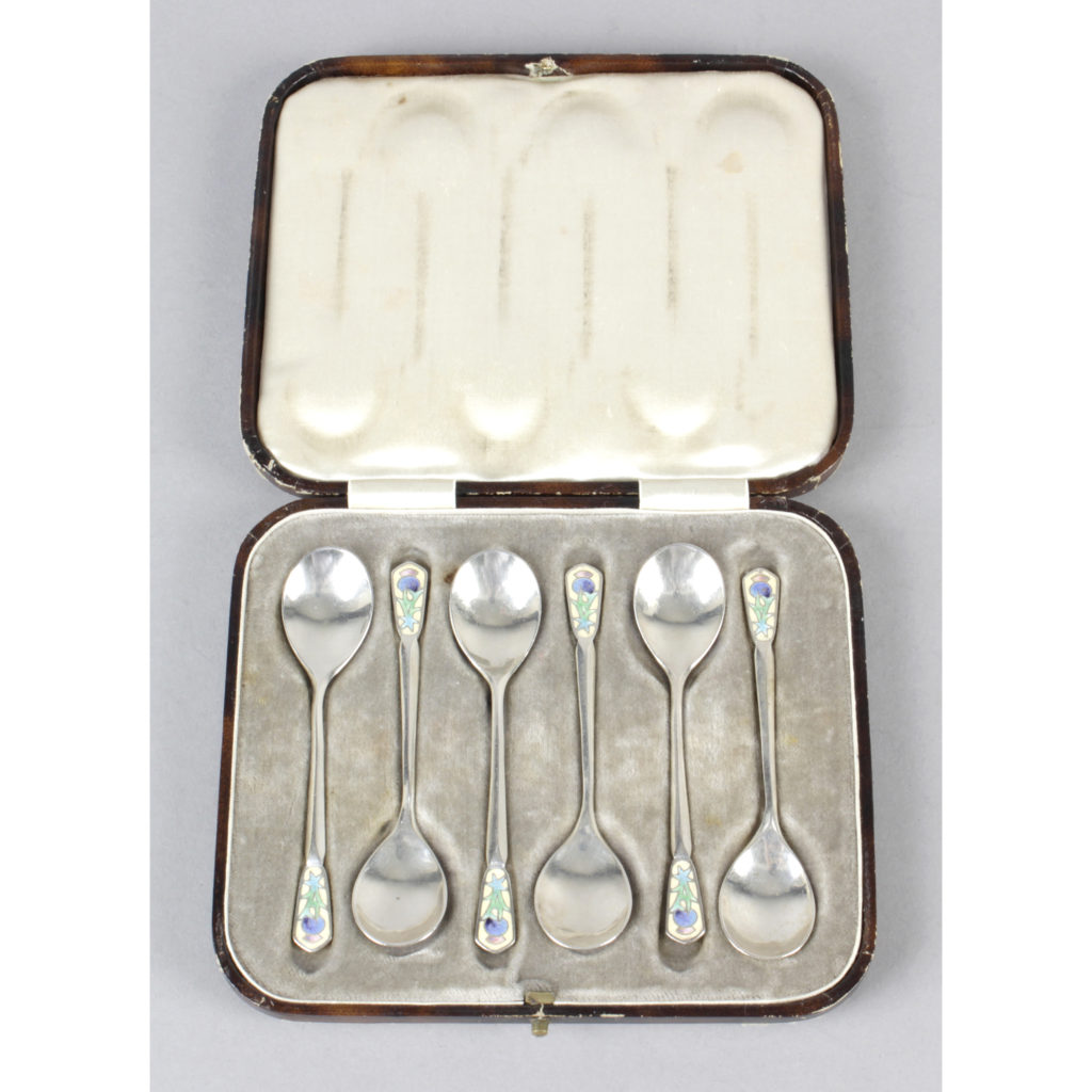 set of six Arts & Crafts style silver and enamel spoons by Bernard Instone