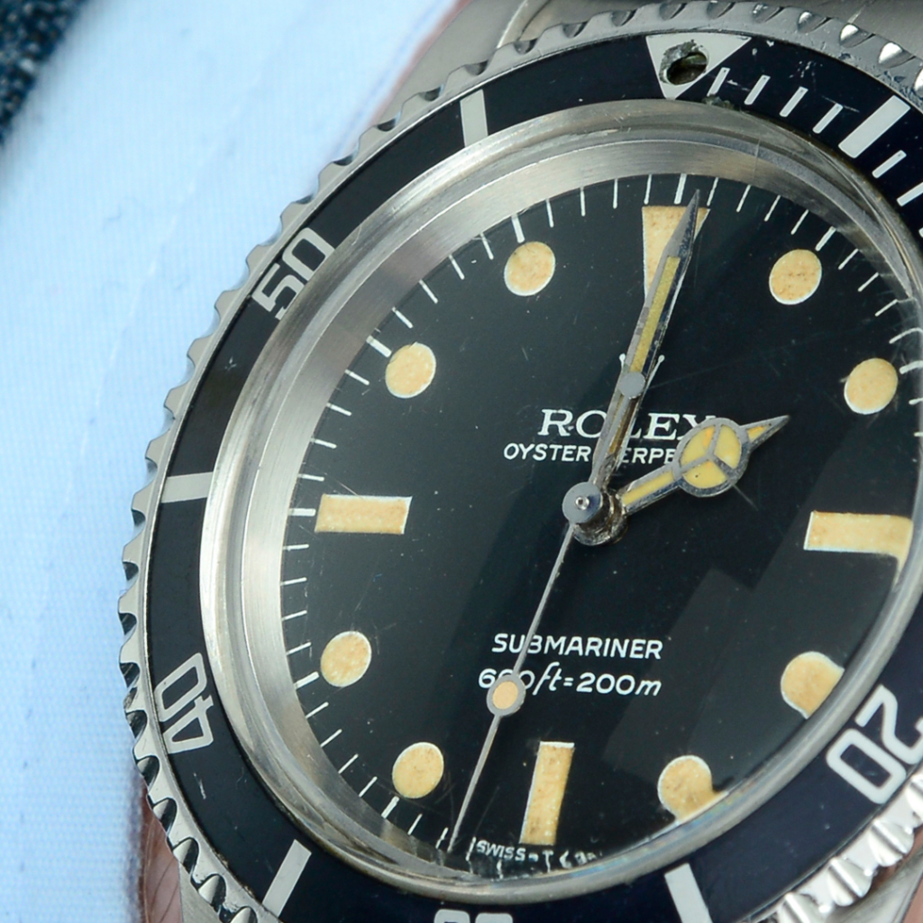closeup of Rolex Submariner 5513 dive watch dial