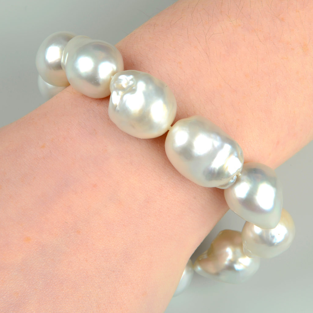 An 18ct gold South Sea baroque cultured pearl bracelet, with diamond clasp, by Mikimoto.