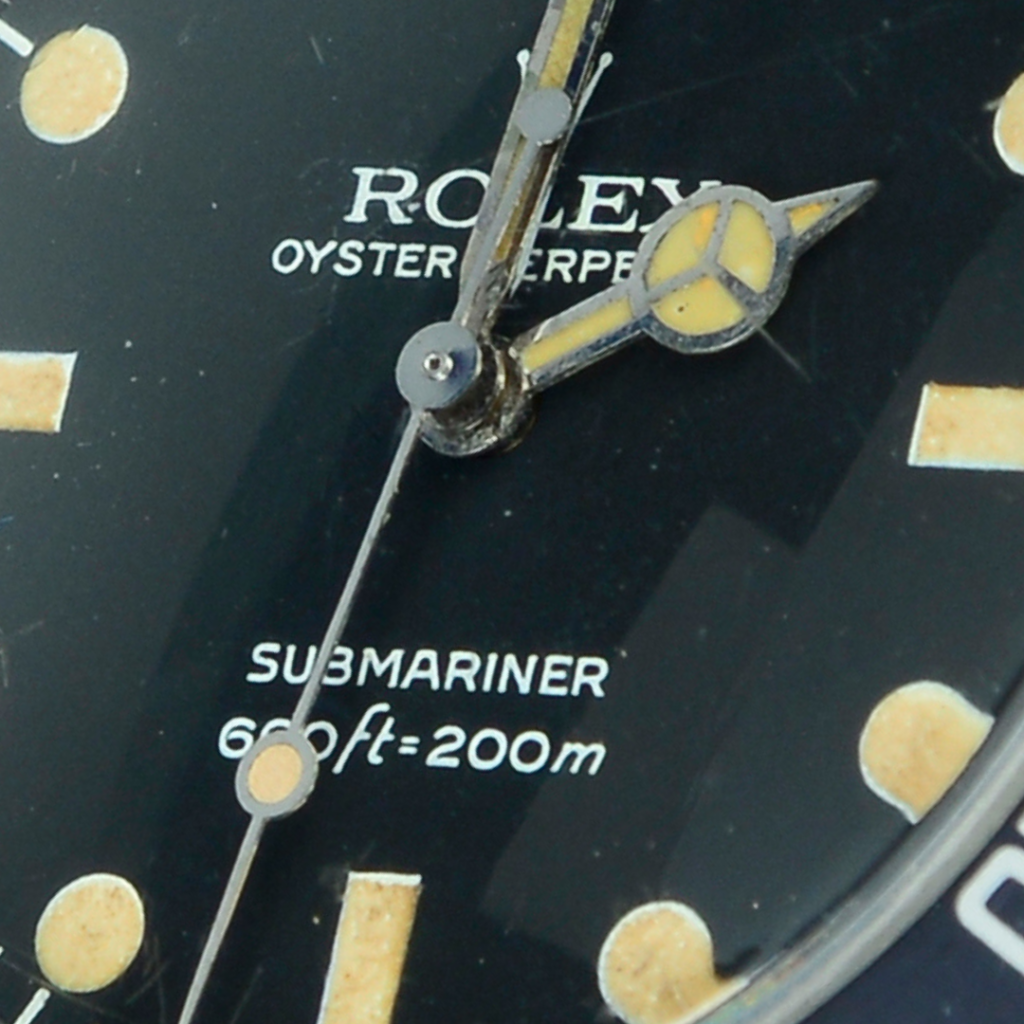 closeup of Rolex Submariner 5513 dive watch dial numbers