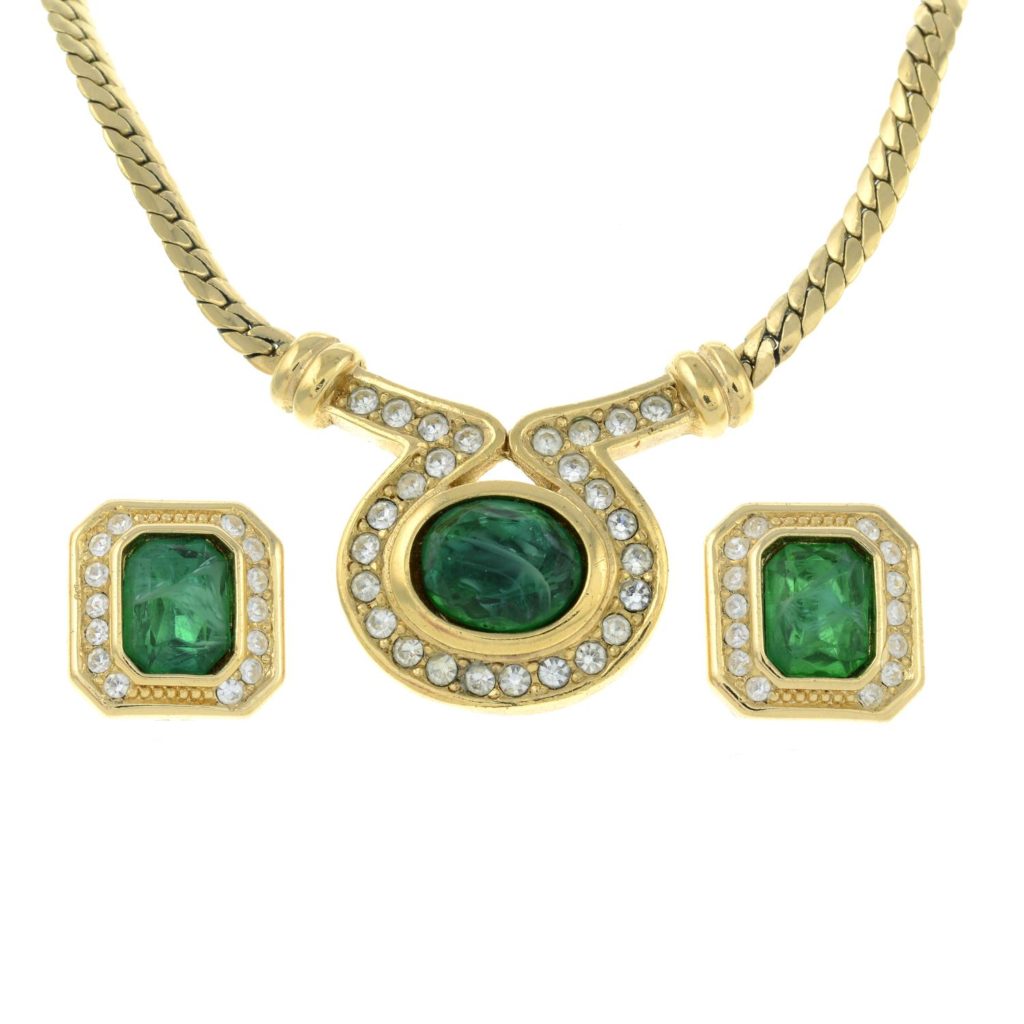 CHRISTIAN DIOR - a green glass pendant necklace with matching stud earrings.