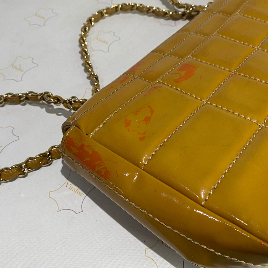 Chanel bag before with visible damage