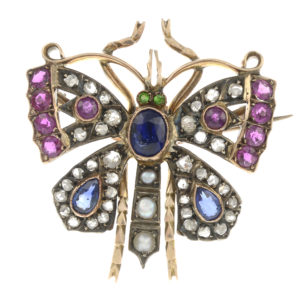 A late 19th century gold and silver gem set butterfly brooch