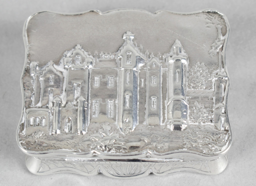 An early Victorian silver 'castle top' vinaigrette depicting Abbotsford House.