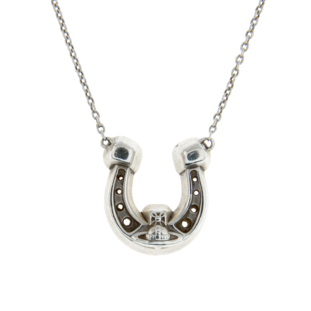 VIVIENNE WESTWOOD - a horseshoe pendant on chain.