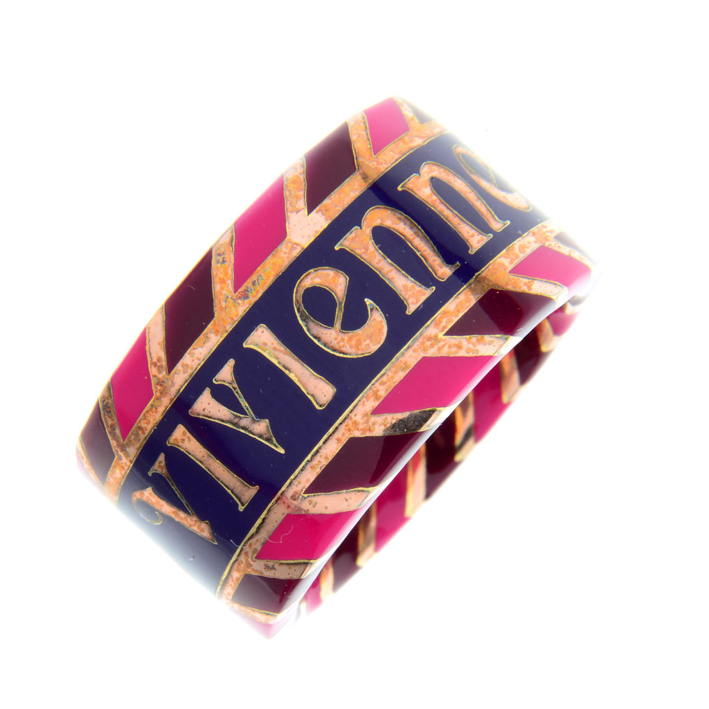 VIVIENNE WESTWOOD - a pink and purple enamel large band ring.