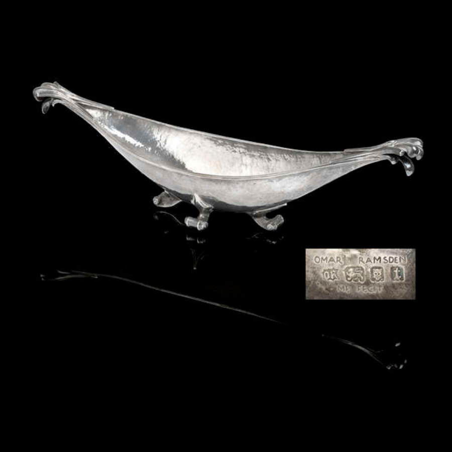 An Arts & Crafts silver dish by Omar Ramsden.