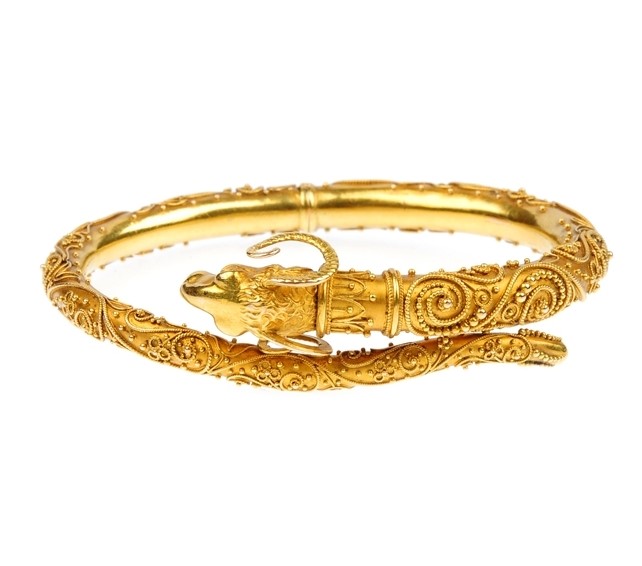 Etruscan revival jewellery. A late 19th century Rams head bangle, circa 1860.