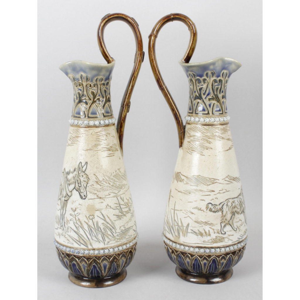 A pair of Royal Doulton ewers by Hannah Barlow
