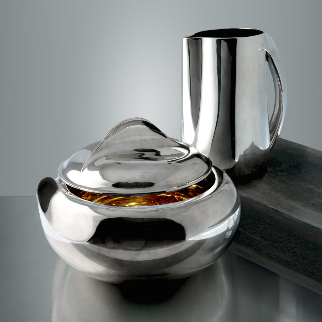 Tiffany & Co., sterling silver pitcher and 'Thumbprint' tureen designed by Elsa Peretti.
