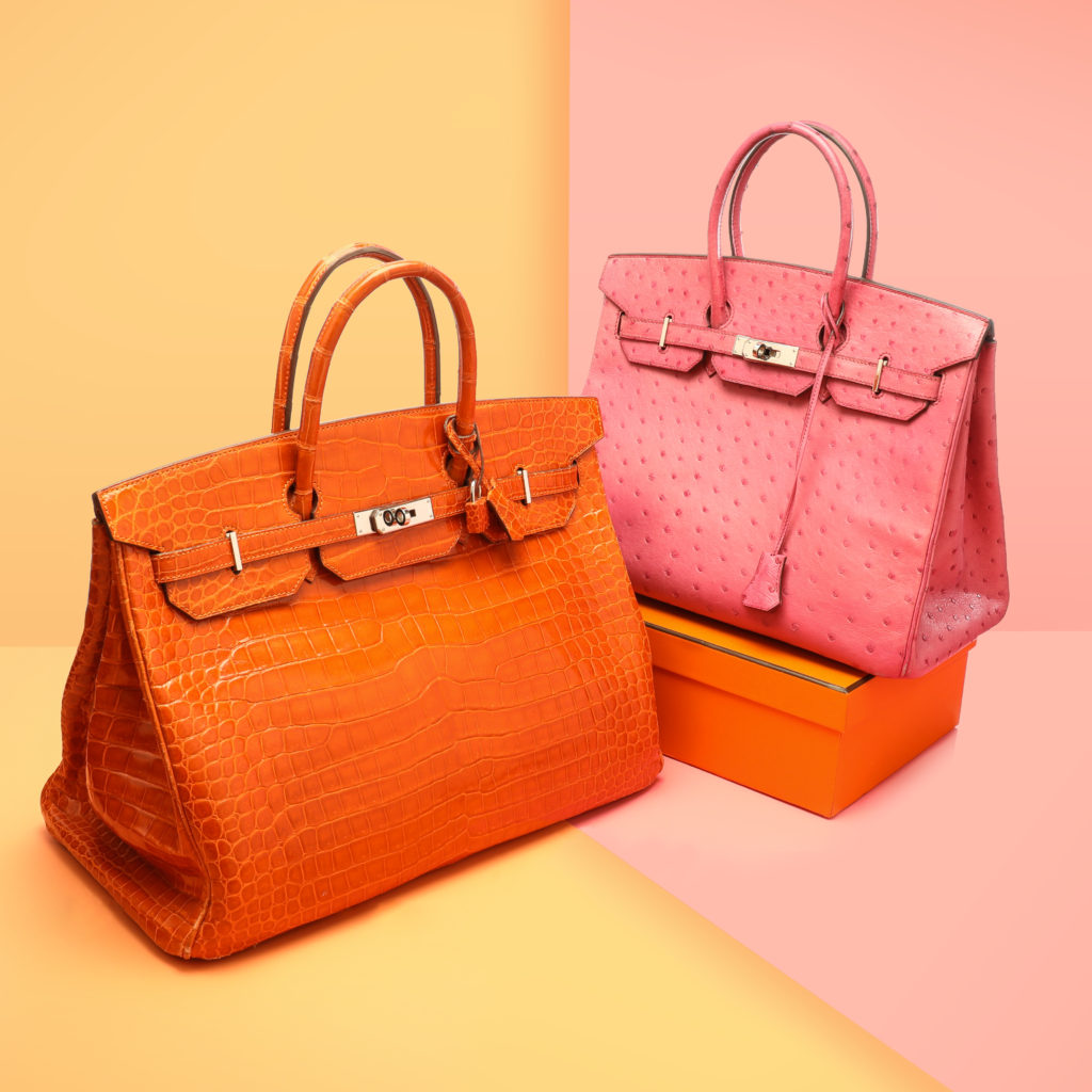 Two Hermès Bags with one rested on top of a branded box