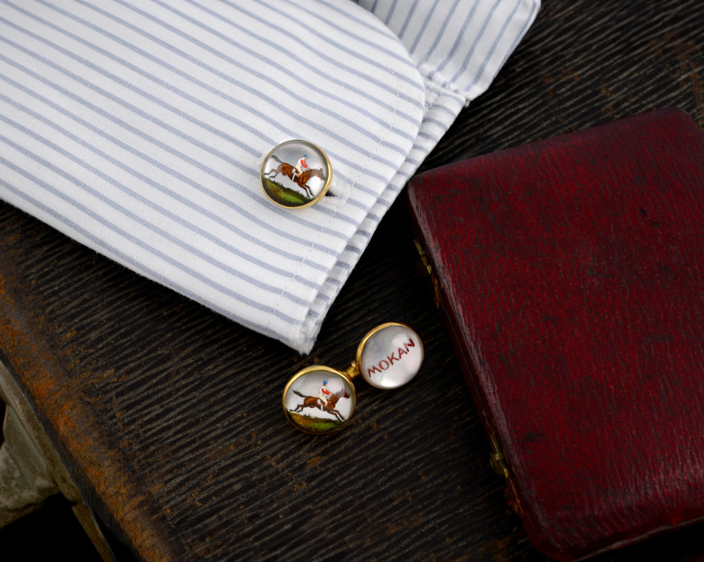 Vienna. early c20th. 14ct gold, reverse intaglio rock crystal cufflinks depicting Mokan, the prize-winning racehorse